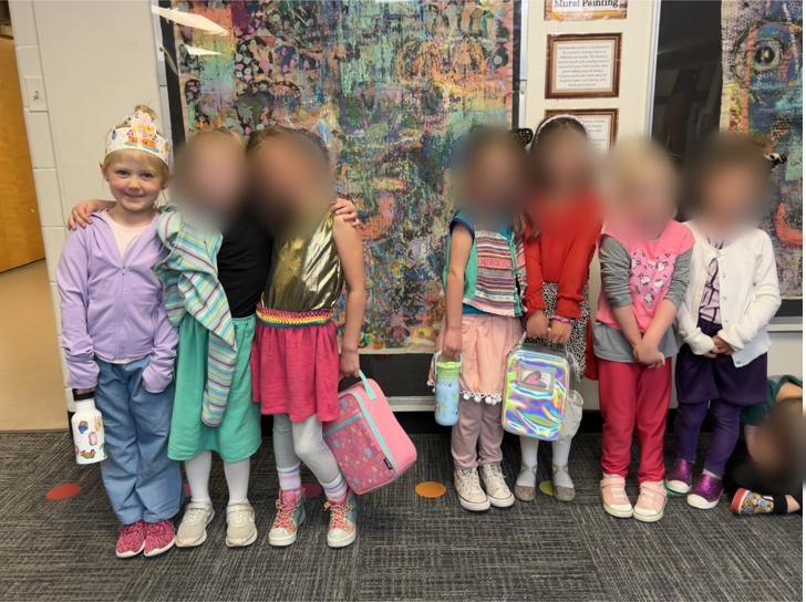 Kids wearing the finished outfits