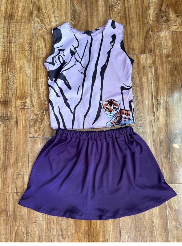 Lavender kitten top with purple skirt