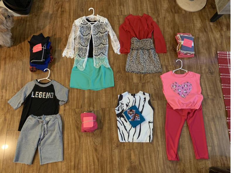 Finished clothes laid out on the floor